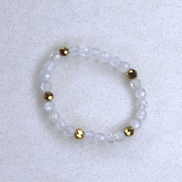 Gemstone white-topaz ring on spotted white marble background