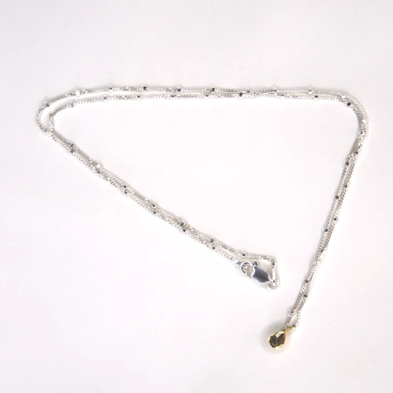 full view sterling silver hope necklace with a gold vermeil polki diamond pendant on a white background