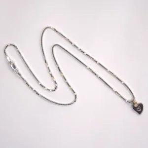 full view sterling silver Venetian necklace with a sterling silver authentic heart pendant and a 14K yellow gold diamond pendant on white background